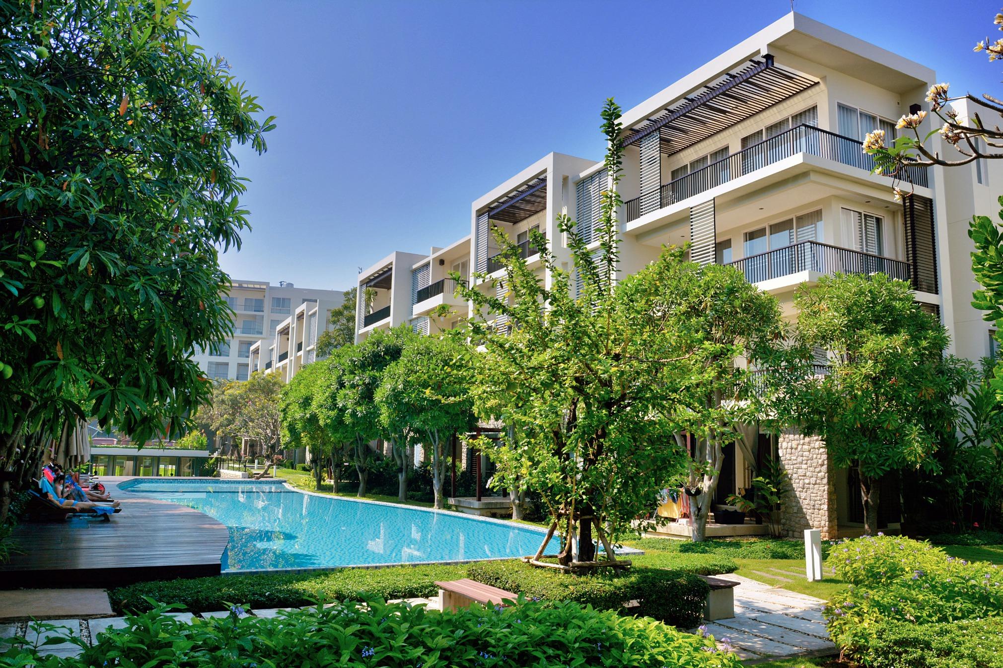 PropertyLink property - luxury residential complex with pool and greenery